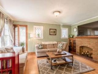 _A6A4421-HDR a photograph of a cozy family room with a brick fireplace